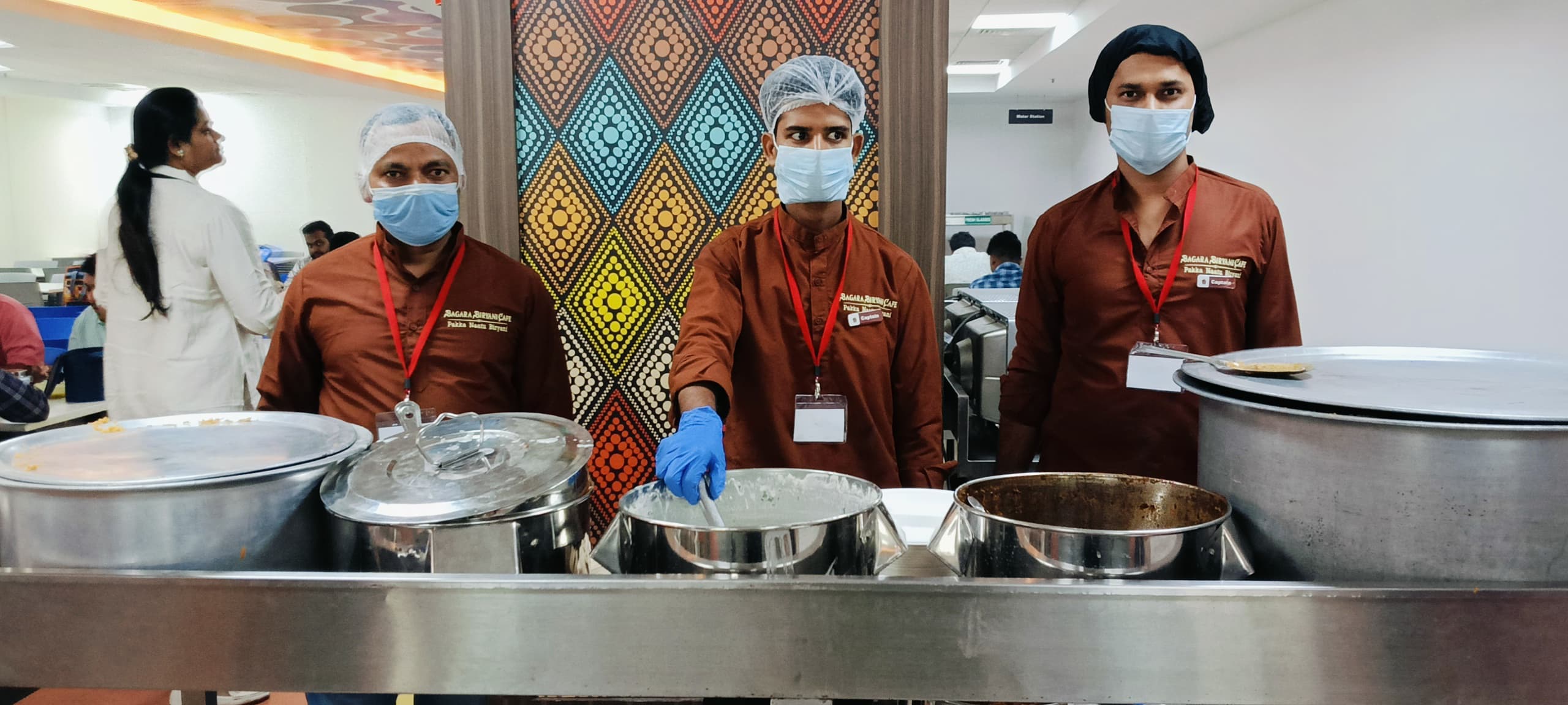 A small party pack of biryani in a container.