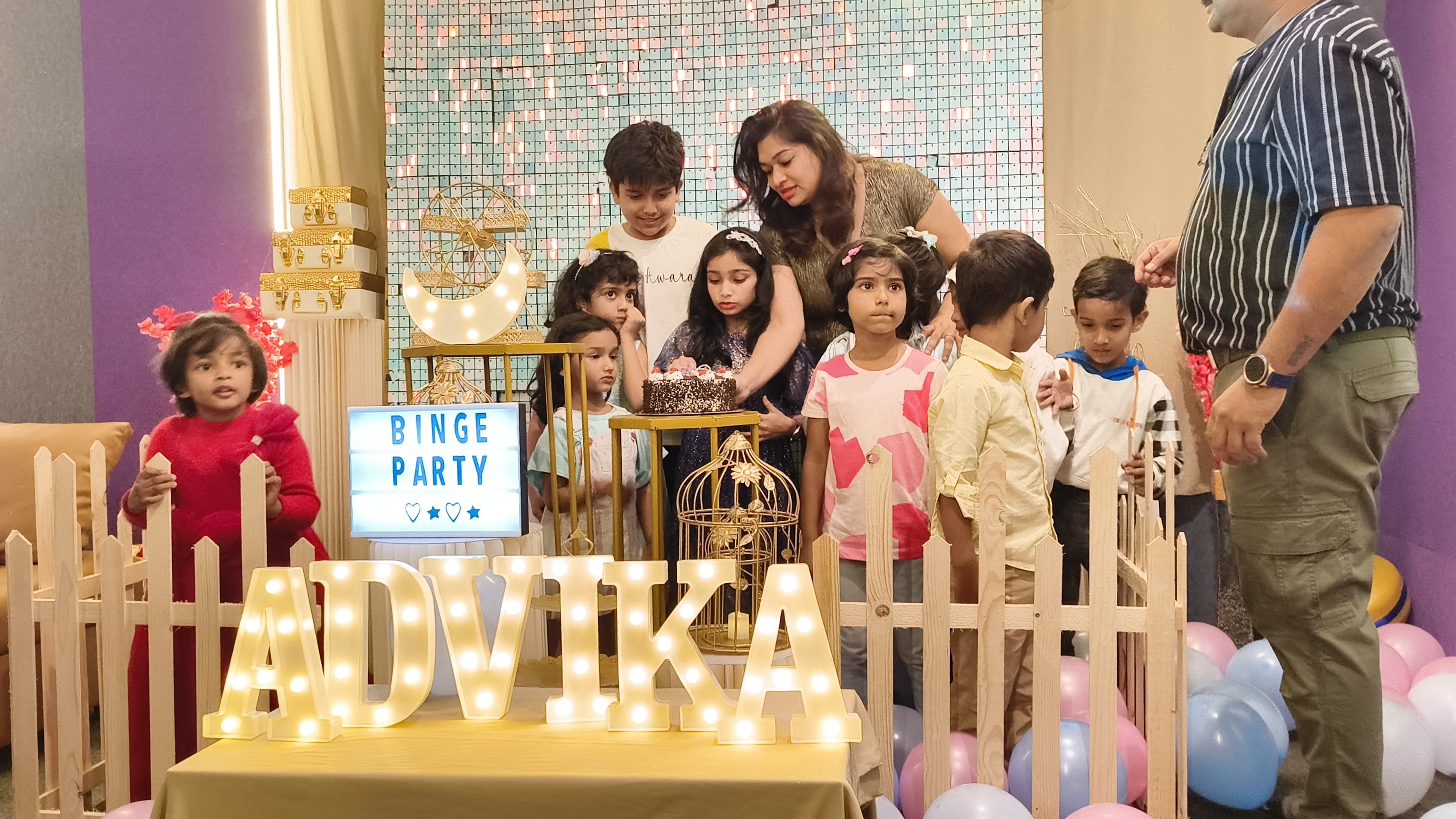 A vibrant party scene with people enjoying a meal.